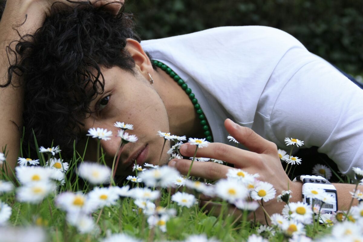 man-lying-down-on-flower-bed