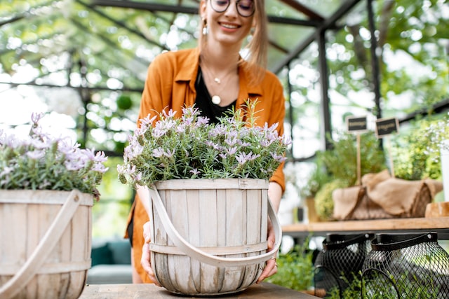 Young woman taking care of plants