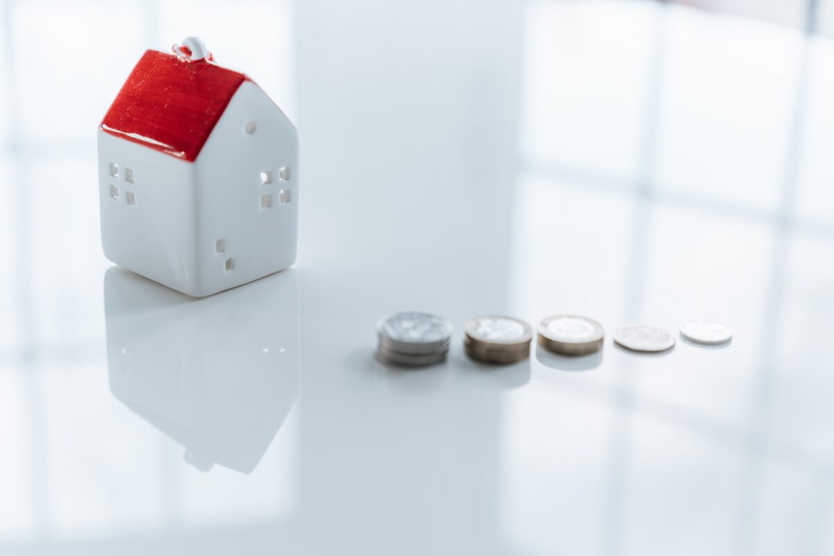 house model with coins on the table