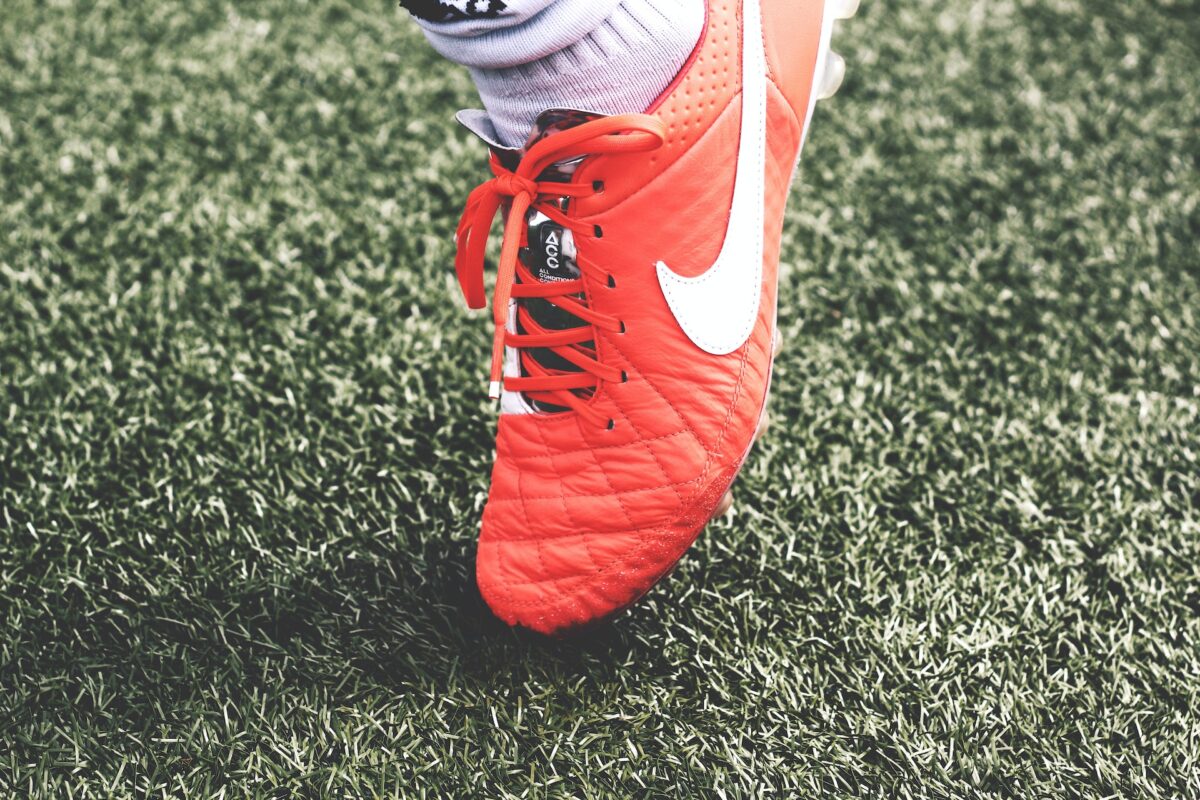 football boots on fake grass
