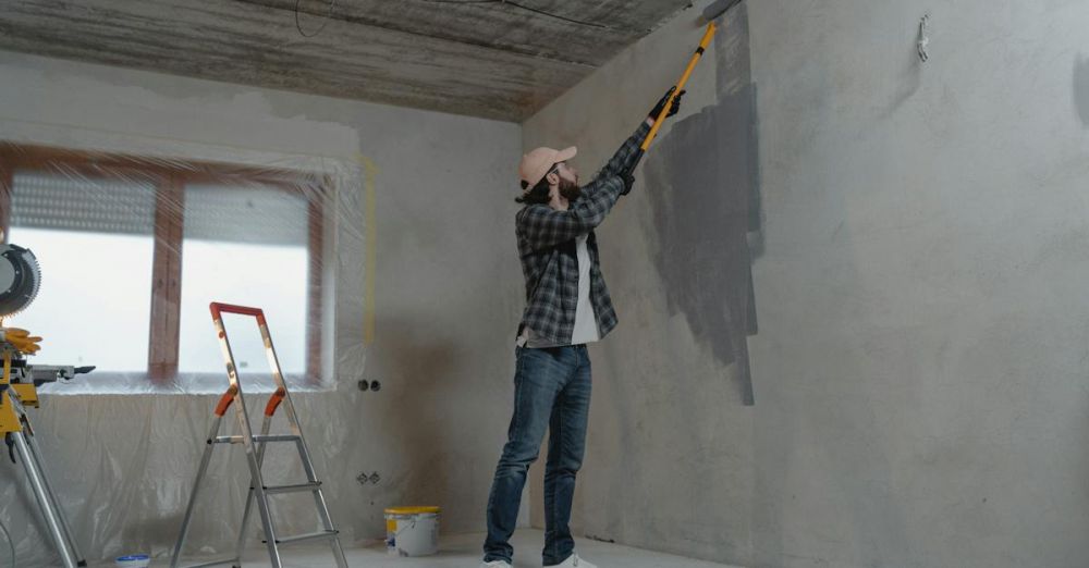 DIY Home Renovation - Man Painting the Wall