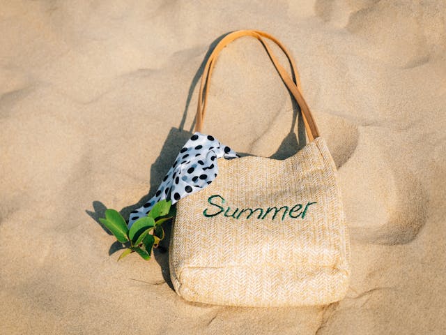 woven-shoulder-bag-with-a-scarf-on-the-sand