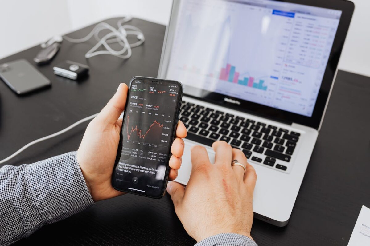 stock-market-charts-on-phone-and-laptop