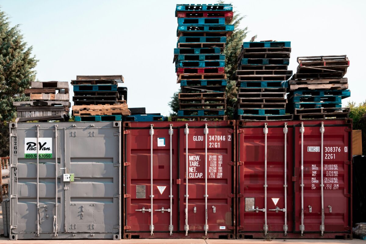 red-steel-container-van-under-white-sky-during-daytime