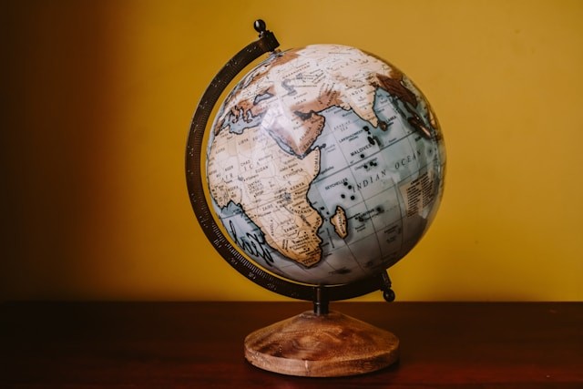 white-and-brown-desk-globe