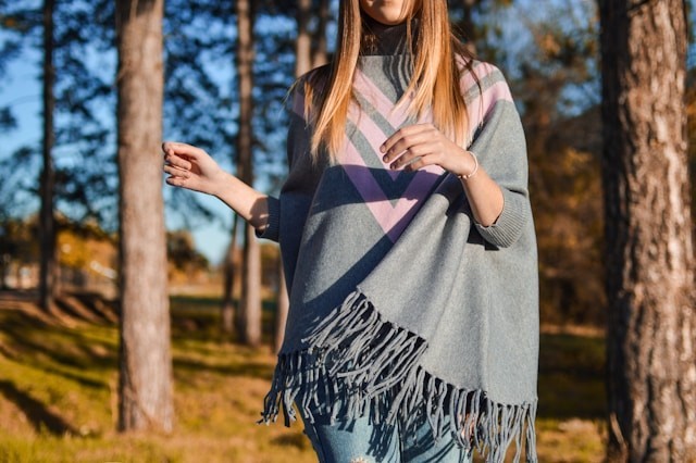 woman-standing-surrounded-by-tress