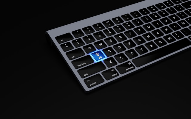 a-black-keyboard-with-a-blue-button-on-it