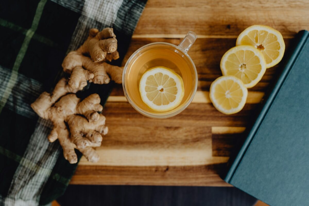 a-cup-of-tea-with-lemon-and-ginger-on-a-wooden-table
